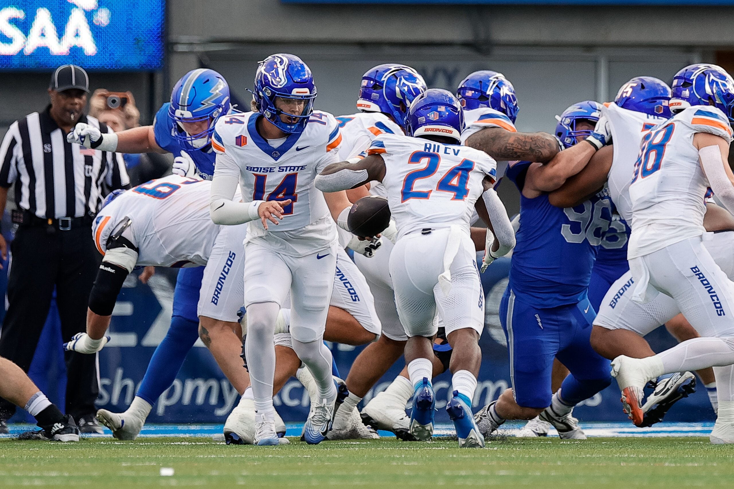 Sep 20, 2025; Colorado Springs, Colorado, USA; Boise State Broncos quarterback Max Cutforth (14) hands the ball off to running back Dylan Riley (24) in the first quarter against the Air Force Falcons at Falcon Stadium. Mandatory Credit: Isaiah J. Downing-Imagn Images