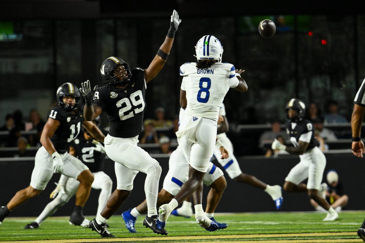 Sep 20, 2025; Nashville, Tennessee, USA; Vanderbilt Commodores edge Miles Capers (29) flushes Georgia State Panthers quarterback Cameran Brown (8) from the pocket during the first half at FirstBank Stadium. Mandatory Credit: Steve Roberts-Imagn Images