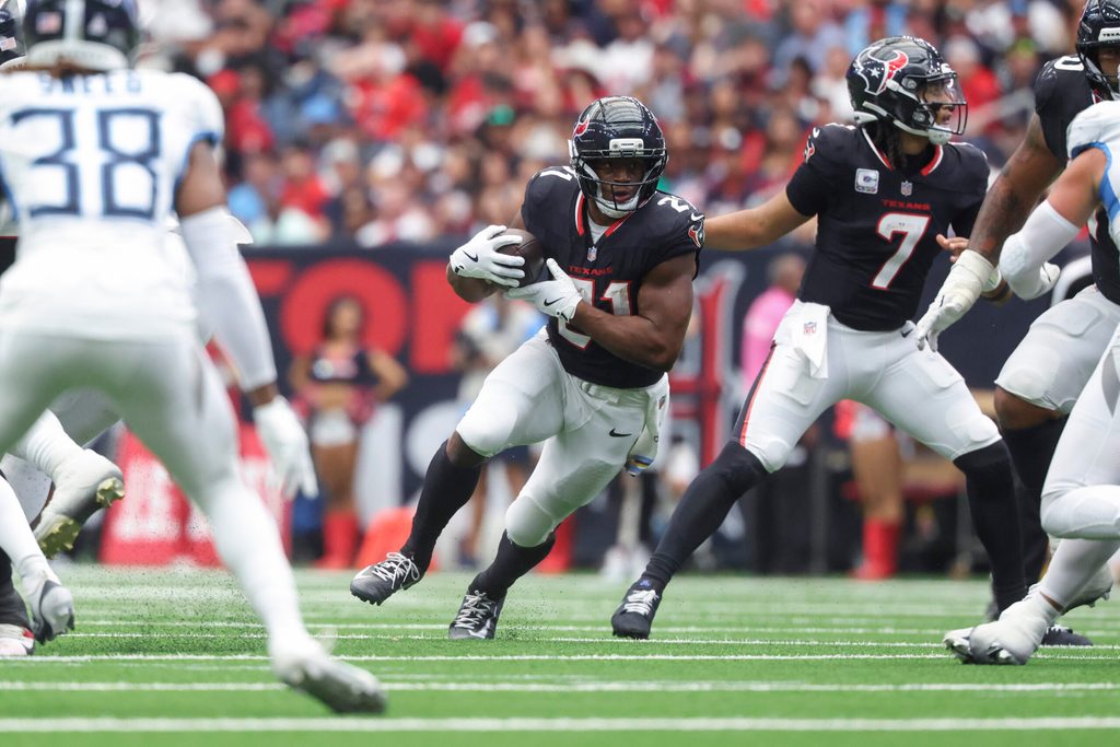 Sep 28, 2025; Houston, Texas, USA; Houston Texans running back Nick Chubb (21) runs with the ball during the fourth quarter against the Tennessee Titans at NRG Stadium. Mandatory Credit: Troy Taormina-Imagn Images