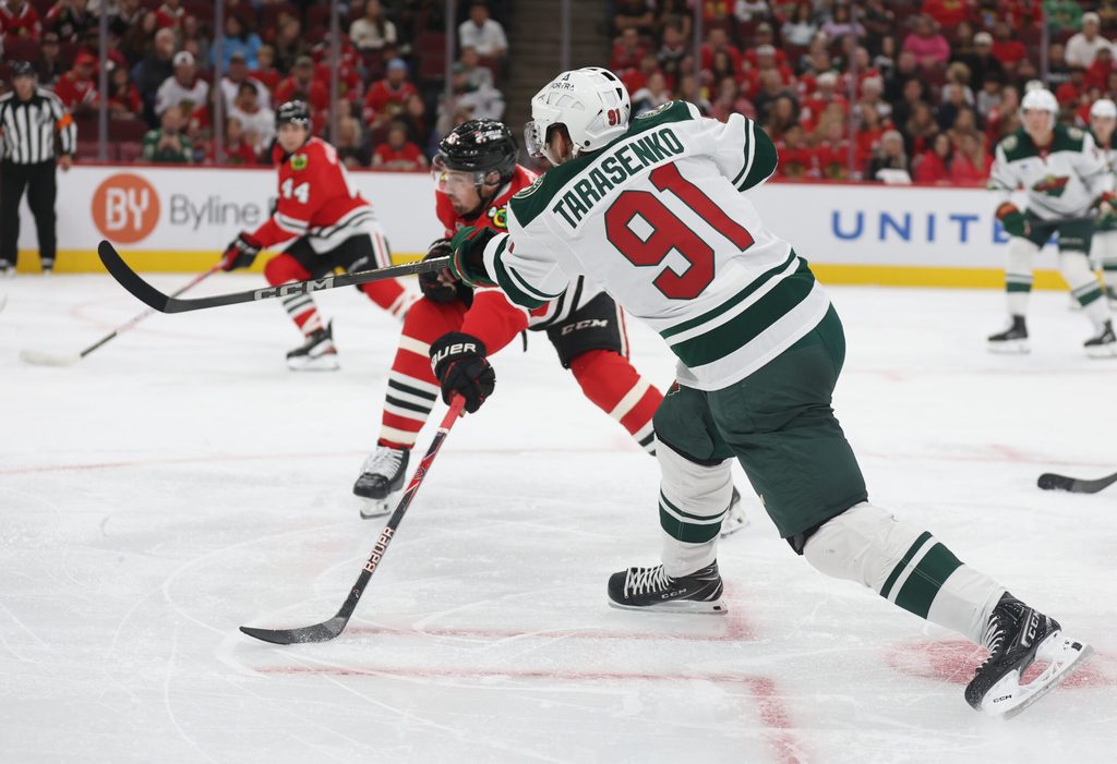 Oct 3, 2025; Chicago, Illinois, USA; Minnesota Wild right wing Vladimir Tarasenko (91) scores during the second period against the Chicago Blackhawks at United Center. Mandatory Credit: Talia Sprague-Imagn Images