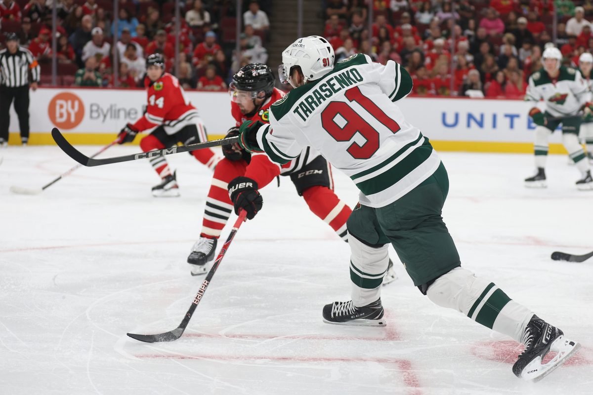 Oct 3, 2025; Chicago, Illinois, USA; Minnesota Wild right wing Vladimir Tarasenko (91) scores during the second period against the Chicago Blackhawks at United Center. Mandatory Credit: Talia Sprague-Imagn Images