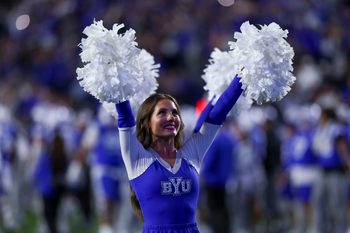 Oct 3, 2025; Provo, Utah, USA; A. Brigham Young Cougars cheerleader performs between the third and fourth quarter of the game against the West Virginia Mountaineers at LaVell Edwards Stadium. Mandatory Credit: Rob Gray-Imagn Images