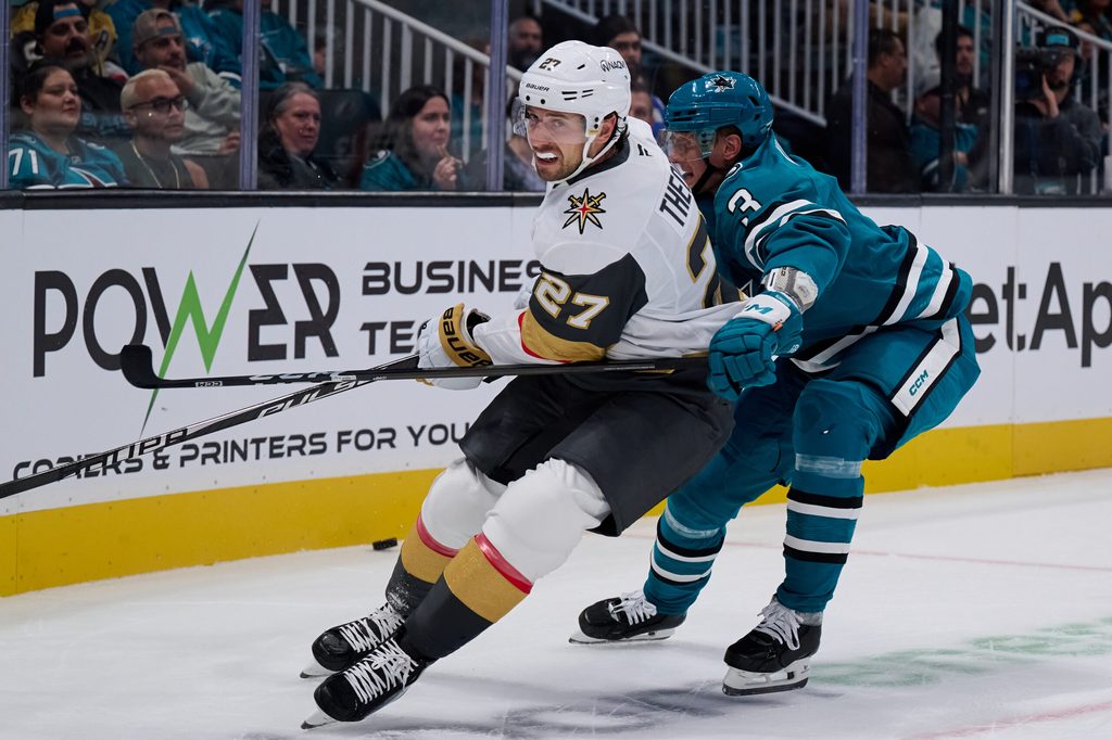 Oct 9, 2025; San Jose, California, USA; Vegas Golden Knights defenseman Shea Theodore (27) vies for position against San Jose Sharks defenseman John Klingberg (3) during the first period at SAP Center at San Jose. Mandatory Credit: Robert Edwards-Imagn Images