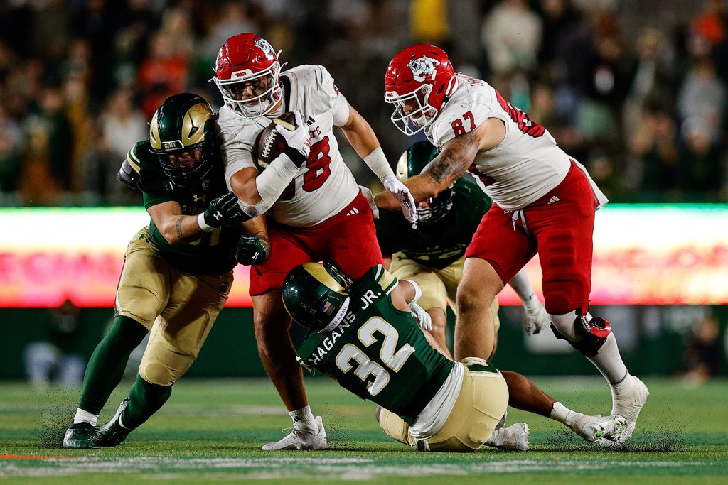Oct 10, 2025; Fort Collins, Colorado, USA; Fresno State Bulldogs tight end Richie Anderson III (88) is tackled by Colorado State Rams defensive back D'Angelo Hagans Jr. (32) as defensive lineman Moso'Oipala Tuitele (91) and tight end Jake Tarwater (87) defend in the third quarter at Sonny Lubick Field at Canvas Stadium. Mandatory Credit: Isaiah J. Downing-Imagn Images
