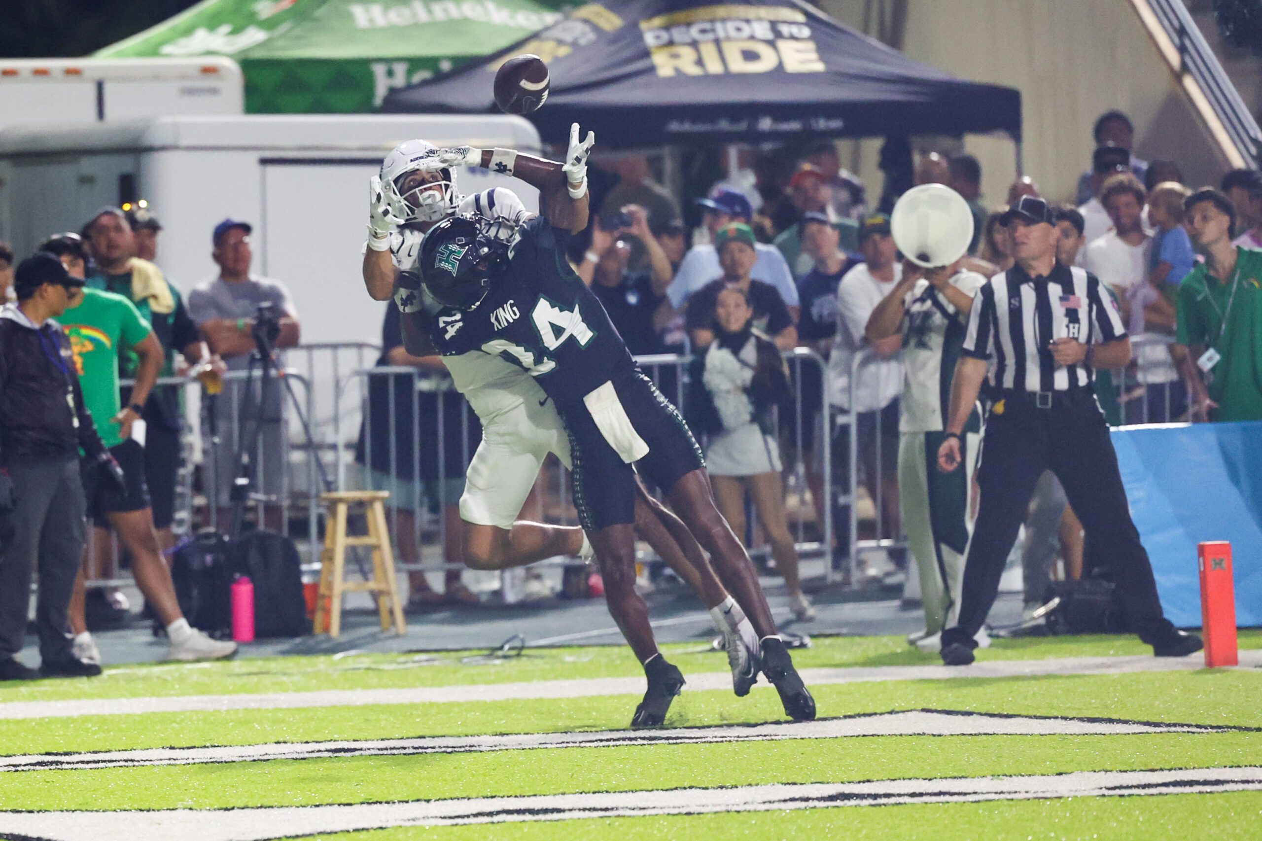 Oct 11, 2025; Honolulu, Hawaii, USA;  Hawaii Rainbow Warriors defensive back Devyn King (24) breaks up a catch intended for Utah State Aggies wide receiver Braden Pegan (11) during the first half at Clarence T.C. Ching Athletics Complex. Mandatory Credit: Marco Garcia-Imagn Images