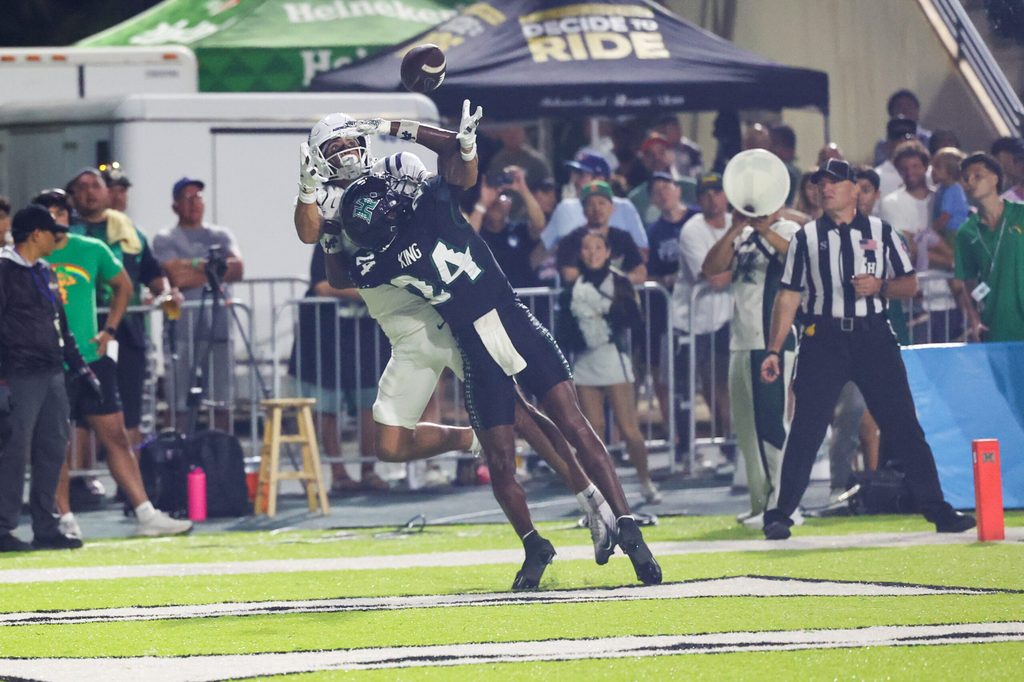 Oct 11, 2025; Honolulu, Hawaii, USA; Hawaii Rainbow Warriors defensive back Devyn King (24) breaks up a catch intended for Utah State Aggies wide receiver Braden Pegan (11) during the first half at Clarence T.C. Ching Athletics Complex. Mandatory Credit: Marco Garcia-Imagn Images