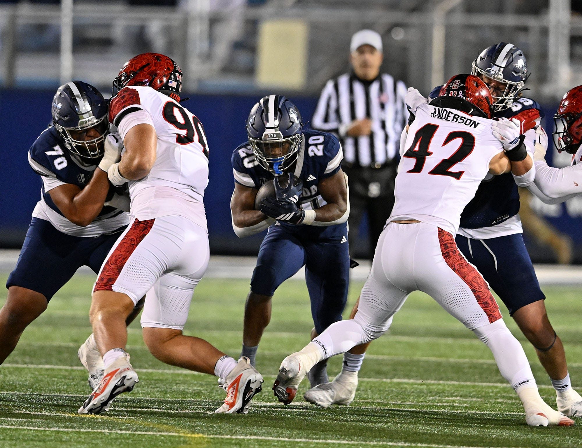 Nevada's Caleb Ramseur finds a hole to run the ball through against San Diego State at Mackay Stadium on Saturday Oct. 11, 2025