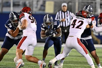 Nevada's Caleb Ramseur finds a hole to run the ball through against San Diego State at Mackay Stadium on Saturday Oct. 11, 2025