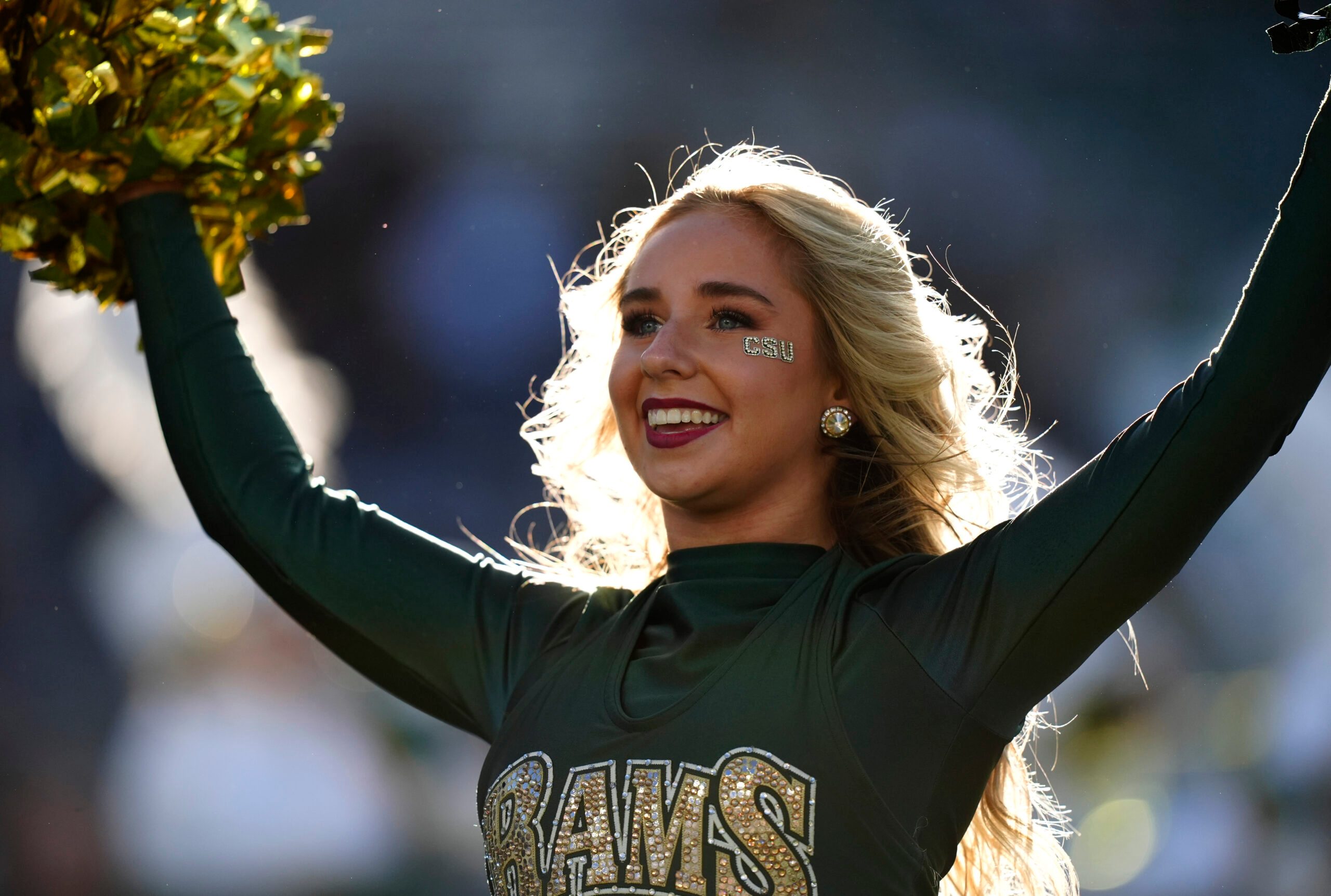 Oct 18, 2025; Fort Collins, Colorado, USA; Colorado State Rams cheerleader performs in the first quarter against the Hawaii Rainbow Warriors at Sonny Lubick Field at Canvas Stadium. Mandatory Credit: Ron Chenoy-Imagn Images
