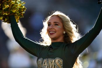 Oct 18, 2025; Fort Collins, Colorado, USA; Colorado State Rams cheerleader performs in the first quarter against the Hawaii Rainbow Warriors at Sonny Lubick Field at Canvas Stadium. Mandatory Credit: Ron Chenoy-Imagn Images