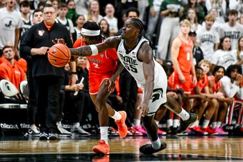Michigan State's Coen Carr, right, and Bowling Green's Javontae Campbell go after a ball after Carr blocks Campbell's shot during the second half on Thursday, Oct. 23, 2025, at the Breslin Center in East Lansing.