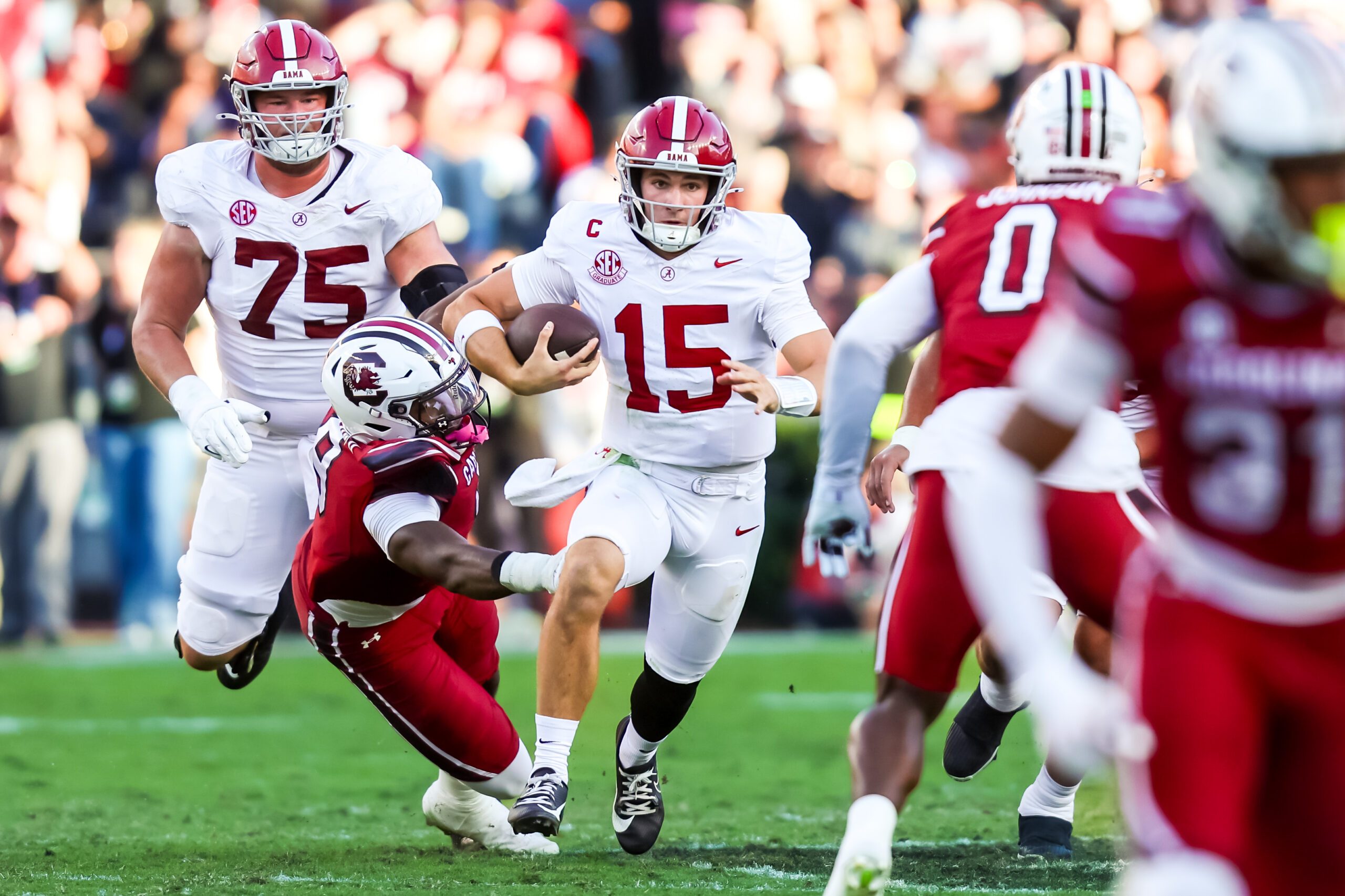 Oct 25, 2025; Columbia, South Carolina, USA; Alabama Crimson Tide quarterback Ty Simpson (15) scrambles for a first down on fourth down against the South Carolina Gamecocks in the second quarter at Williams-Brice Stadium. Mandatory Credit: Jeff Blake-Imagn Images