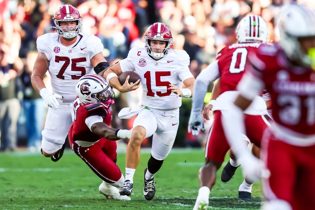 Oct 25, 2025; Columbia, South Carolina, USA; Alabama Crimson Tide quarterback Ty Simpson (15) scrambles for a first down on fourth down against the South Carolina Gamecocks in the second quarter at Williams-Brice Stadium. Mandatory Credit: Jeff Blake-Imagn Images