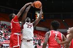 Oct 25, 2025; Pullman, WA, USA; Washington State Cougars forward Nd Okafor (22) is fouled on the shot by New Mexico Lobos guard Tajavis Miller (2) in the second half at Friel Court at Beasley Coliseum. Washington State Cougars won 74-66. Mandatory Credit: James Snook-Imagn Images