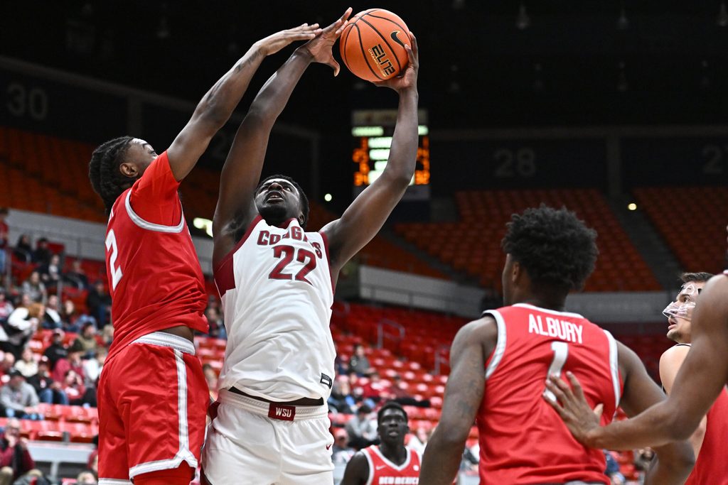 Oct 25, 2025; Pullman, WA, USA; Washington State Cougars forward Nd Okafor (22) is fouled on the shot by New Mexico Lobos guard Tajavis Miller (2) in the second half at Friel Court at Beasley Coliseum. Washington State Cougars won 74-66. Mandatory Credit: James Snook-Imagn Images