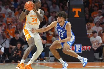 Tennessee forward Felix Okpara (34) tries to moves the ball while guarded by Duke forward Cameron Boozer (12) in a college basketball exhibition game on October 26, 2025, in Knoxville, Tenn.