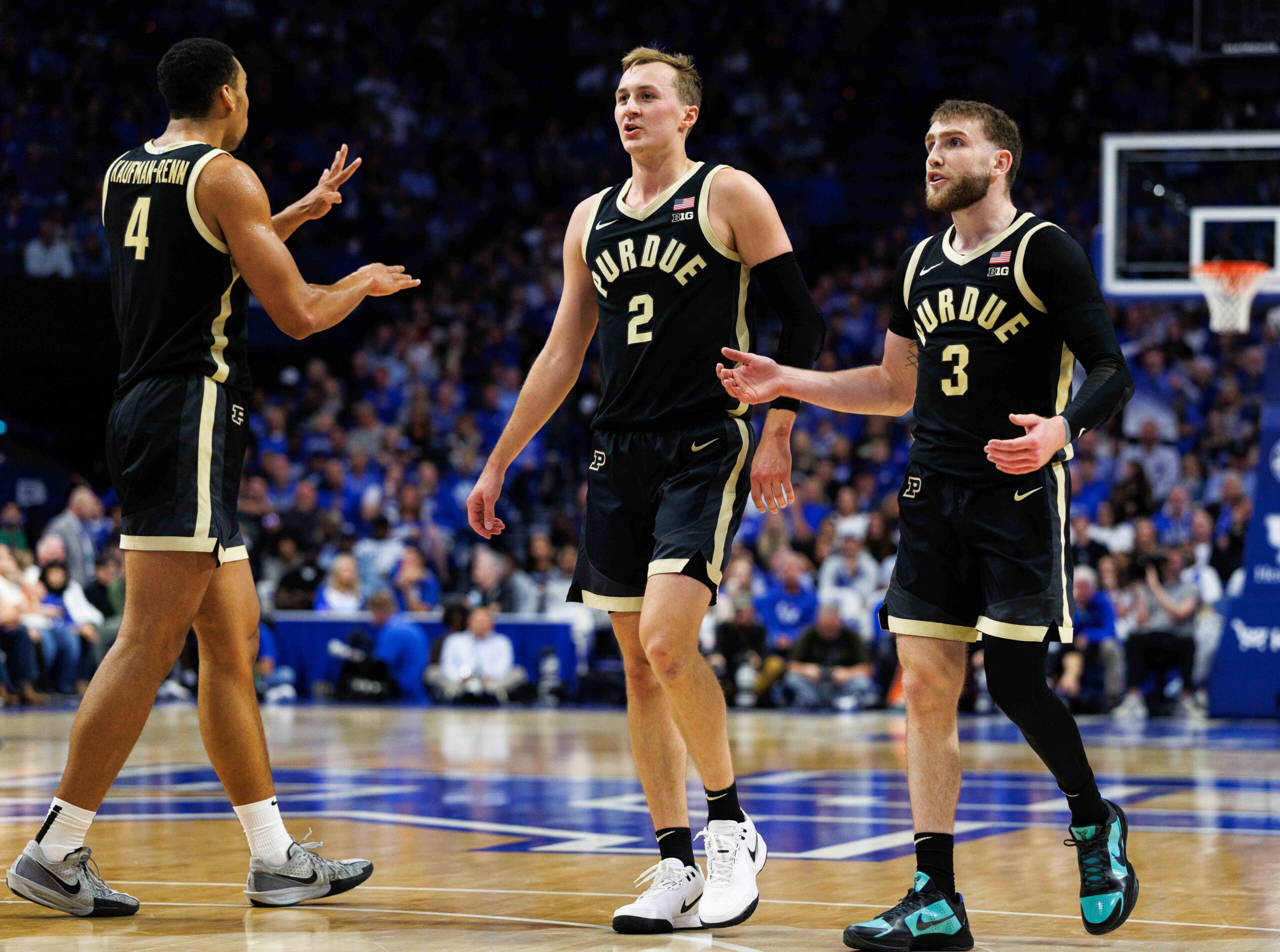 Oct 24, 2025; Lexington, KY, USA; Purdue Boilermakers guard Fletcher Loyer (2), guard Braden Smith (3) and forward Trey Kaufman-Renn (4) huddle up during the first half against the Kentucky Wildcats at Rupp Arena at Central Bank Center. Mandatory Credit: Jordan Prather-Imagn Images