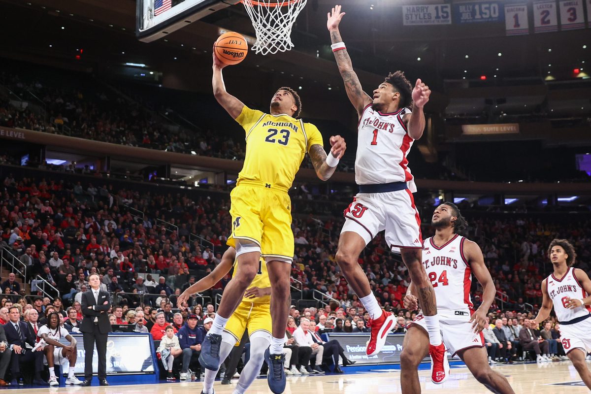 Oct 25, 2025; New York, NY, USA; Michigan Wolverines forward Yaxel Lendeborg (23) and St. John's Red Storm forward Dillon Mitchell (1) at Madison Square Garden. Mandatory Credit: Wendell Cruz-Imagn Images
