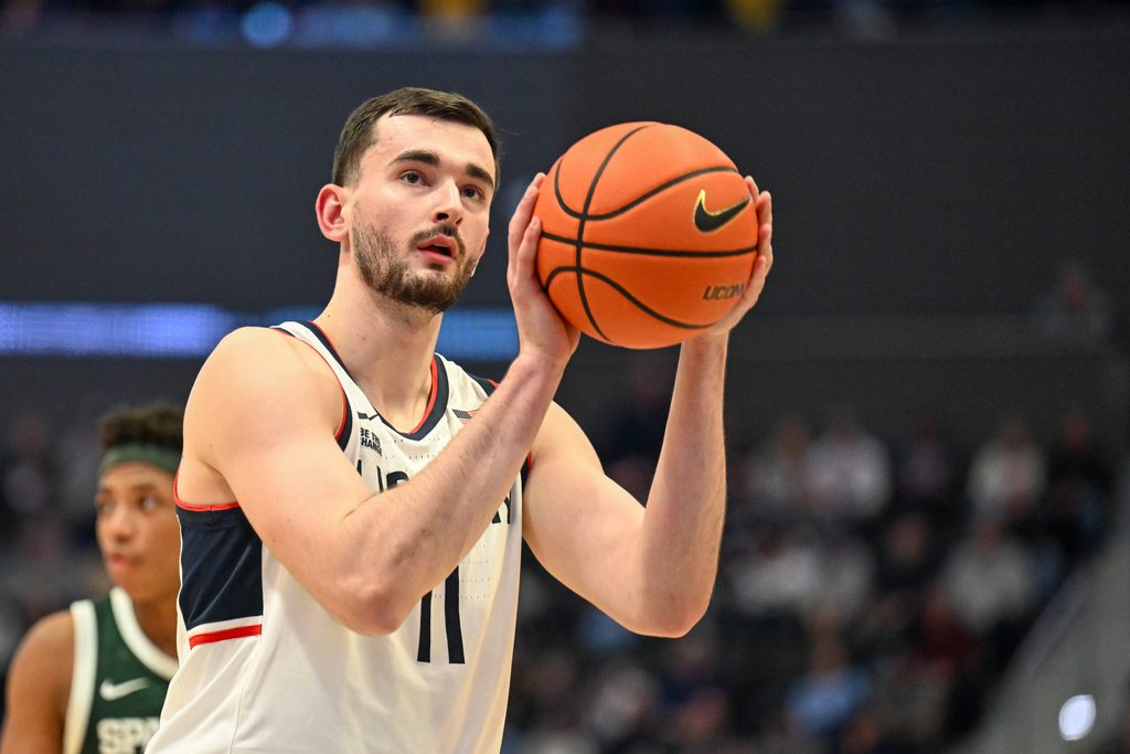 Oct 28, 2025; Hartford, CT, USA; Connecticut Huskies forward Alex Karaban (11) shoot a free throw during the first half against the Michigan State Spartans at PeoplesBank Arena. Mandatory Credit: Mark Smith-Imagn Images