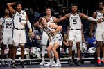 Butler Bulldogs guard Evan Haywood (1), Butler Bulldogs guard Finley Bizjack (11) and Butler Bulldogs forward Michael Ajayi (5) watch from the sidelines on Wednesday, Oct. 29, 2025, during the game at Hinkle Fieldhouse in Indianapolis. The Butler Bulldogs defeated the Indiana State Sycamores, 105-80.