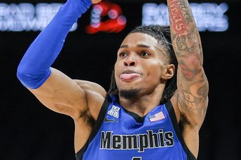 Oct 30, 2025; Atlanta, GA, USA; Memphis Tigers guard Dug McDaniel (1) shoots the ball against the Auburn Tigers during the first half at State Farm Arena. Mandatory Credit: Jordan Godfree-Imagn Images