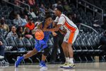 Oct 30, 2025; Atlanta, GA, USA; Memphis Tigers guard Julius Thedford (15) drives the ball toward the basket against Auburn Tigers guard Tahaad Pettiford (0) during the second half at State Farm Arena. Mandatory Credit: Jordan Godfree-Imagn Images