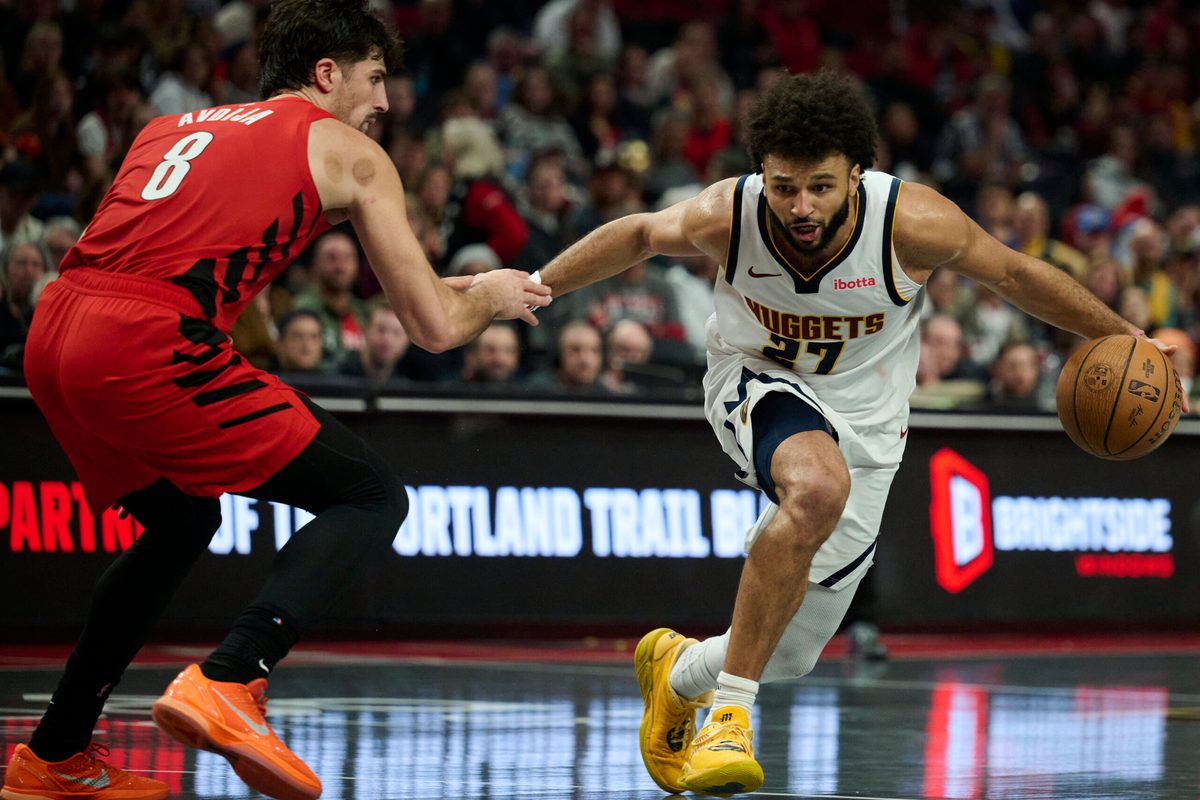 Oct 31, 2025; Portland, Oregon, USA; Denver Nuggets guard Jamal Murray (27) dribbles the ball during the second half against Portland Trail Blazers forward Deni Avdija (8) at Moda Center. Mandatory Credit: Troy Wayrynen-Imagn Images