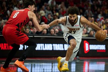 Oct 31, 2025; Portland, Oregon, USA; Denver Nuggets guard Jamal Murray (27) dribbles the ball during the second half against Portland Trail Blazers forward Deni Avdija (8) at Moda Center. Mandatory Credit: Troy Wayrynen-Imagn Images