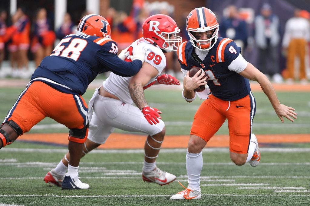 Nov 1, 2025; Champaign, Illinois, USA; Illinois Fighting Illini quarterback Luke Altmyer (9) runs the ball during the first half against the Rutgers Scarlet Knights at Memorial Stadium. Mandatory Credit: Ron Johnson-Imagn Images