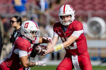 Nov 1, 2025; Stanford, California, USA; Stanford Cardinal quarterback Ben Gulbranson (15) hands off to running back Cole Tabb (33) during warmups before the game against the Pittsburgh Panthers at Stanford Stadium. Mandatory Credit: John Hefti-Imagn Images