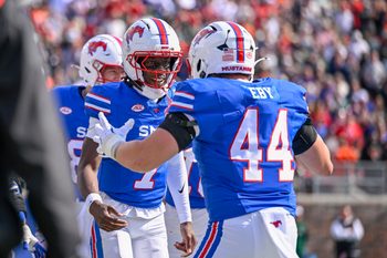 Nov 1, 2025; Dallas, Texas, USA;  SMU Mustangs quarterback Kevin Jennings (7) and tight end Stone Eby (44) celebrates after Jennings scores a touchdown against the Miami Hurricanes during the second half at Gerald J. Ford Stadium. Mandatory Credit: Jerome Miron-Imagn Images