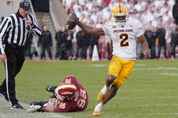 Arizona State Sun Devils quarterback Jeff Sims (2) breaks tackle from Iowa State Cyclones' defensive line Domonique Orange (95) and runs for a first down during the fourth quarter in the Big-12 showdown at jack Trice Stadium on Nov. 1, 2025, in Ames, Iowa.