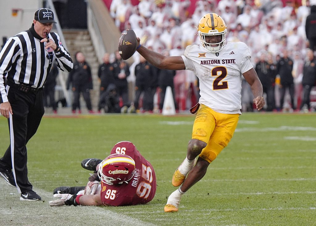 Arizona State Sun Devils quarterback Jeff Sims (2) breaks tackle from Iowa State Cyclones' defensive line Domonique Orange (95) and runs for a first down during the fourth quarter in the Big-12 showdown at jack Trice Stadium on Nov. 1, 2025, in Ames, Iowa.