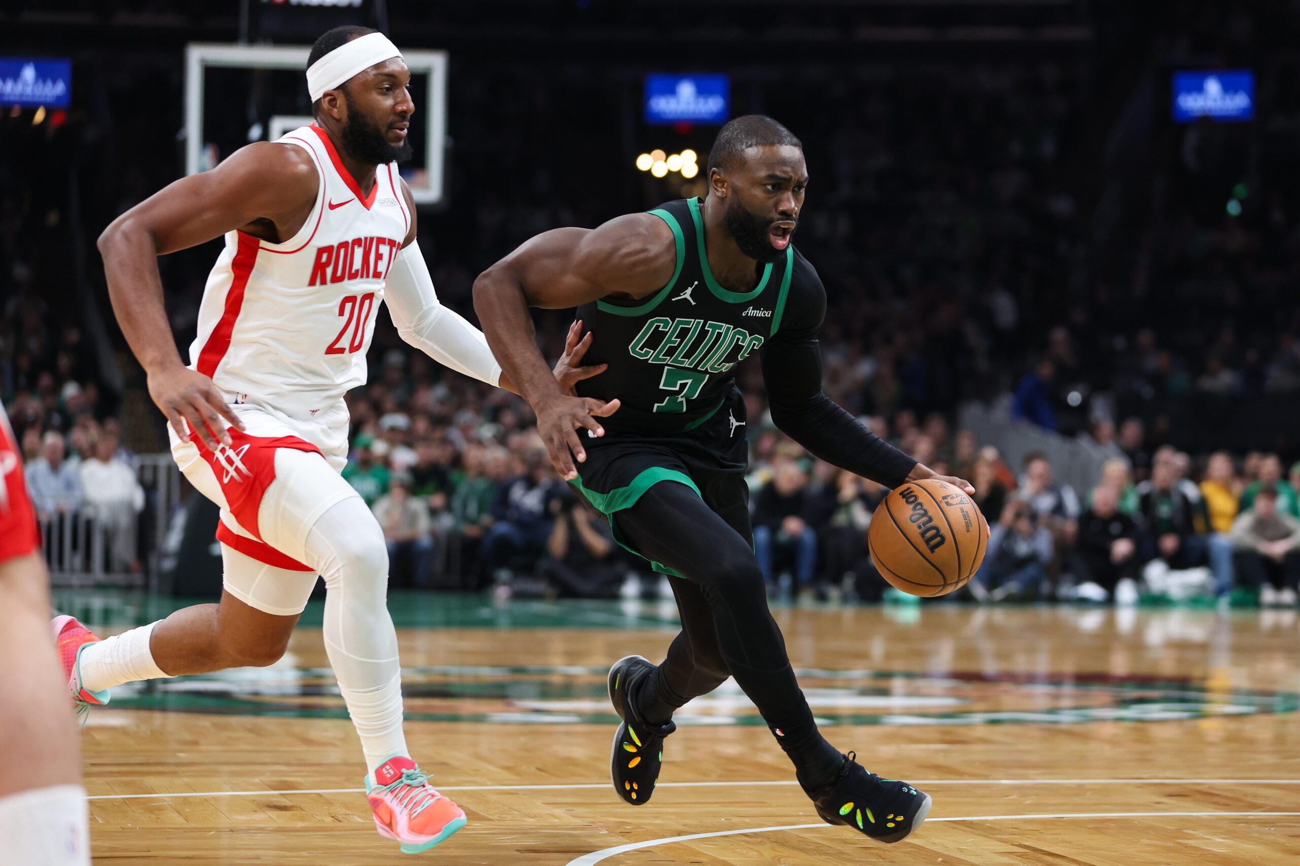 Nov 1, 2025; Boston, Massachusetts, USA; Boston Celtics forward Jaylen Brown (7) drives to the basket during the first half against the Houston Rockets at TD Garden. Mandatory Credit: Paul Rutherford-Imagn Images