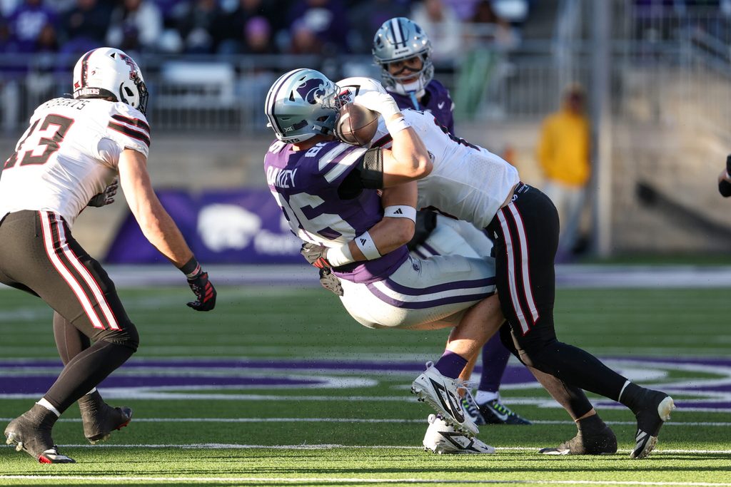 Nov 1, 2025; Manhattan, Kansas, USA; Texas Tech Red Raiders linebacker John Curry (6) tackles Kansas State Wildcats tight end Garrett Oakley (86) during the fourth quarter at Bill Snyder Family Football Stadium. Mandatory Credit: Scott Sewell-Imagn Images