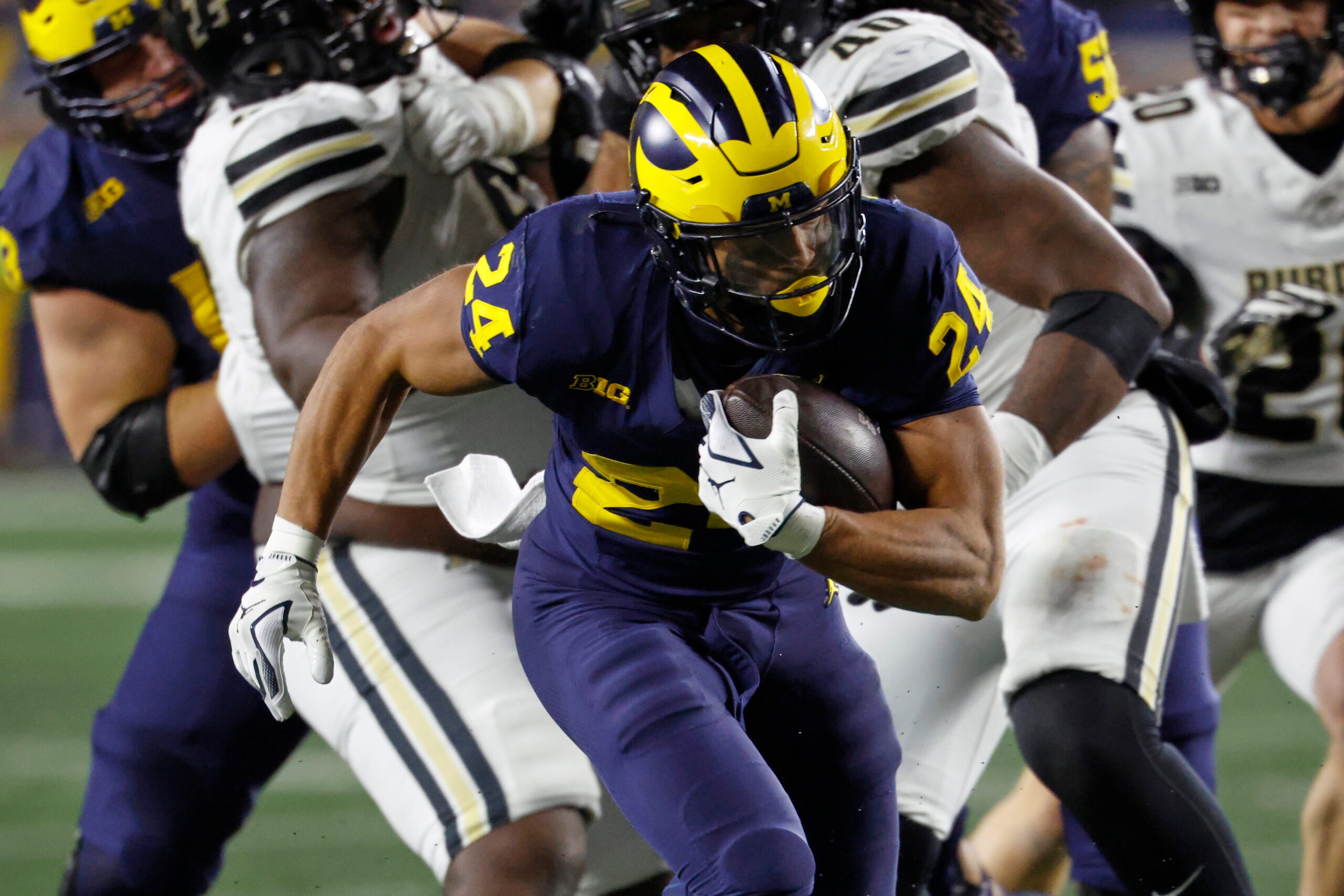 Nov 1, 2025; Ann Arbor, Michigan, USA;  Michigan Wolverines running back Bryson Kuzdzal (24) rushes in the second half against the Purdue Boilermakers at Michigan Stadium. Mandatory Credit: Rick Osentoski-Imagn Images