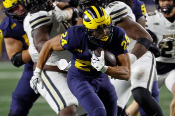 Nov 1, 2025; Ann Arbor, Michigan, USA;  Michigan Wolverines running back Bryson Kuzdzal (24) rushes in the second half against the Purdue Boilermakers at Michigan Stadium. Mandatory Credit: Rick Osentoski-Imagn Images