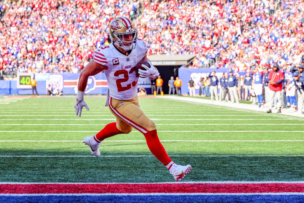 Nov 2, 2025; East Rutherford, New Jersey, USA; San Francisco 49ers running back Christian McCaffrey (23) runs after the catch for a touchdown against the New York Giants during the first half at MetLife Stadium. Mandatory Credit: Ed Mulholland-Imagn Images