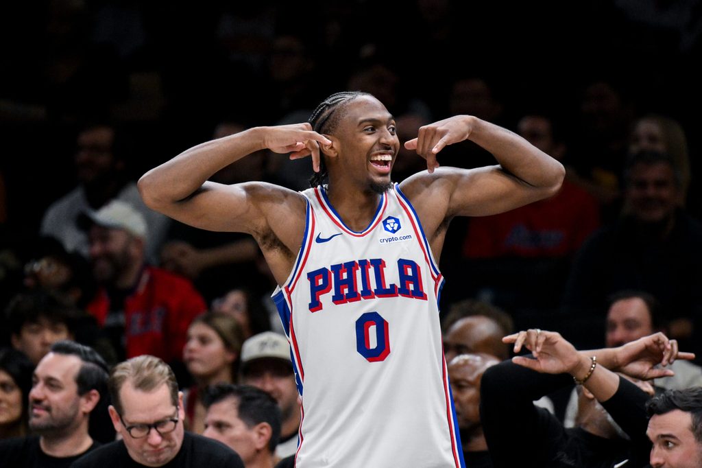 Nov 2, 2025; Brooklyn, New York, USA; Philadelphia 76ers guard Tyrese Maxey (0) flexes his muscles from the bench during the second half against the Brooklyn Nets at Barclays Center. Mandatory Credit: John Jones-Imagn Images