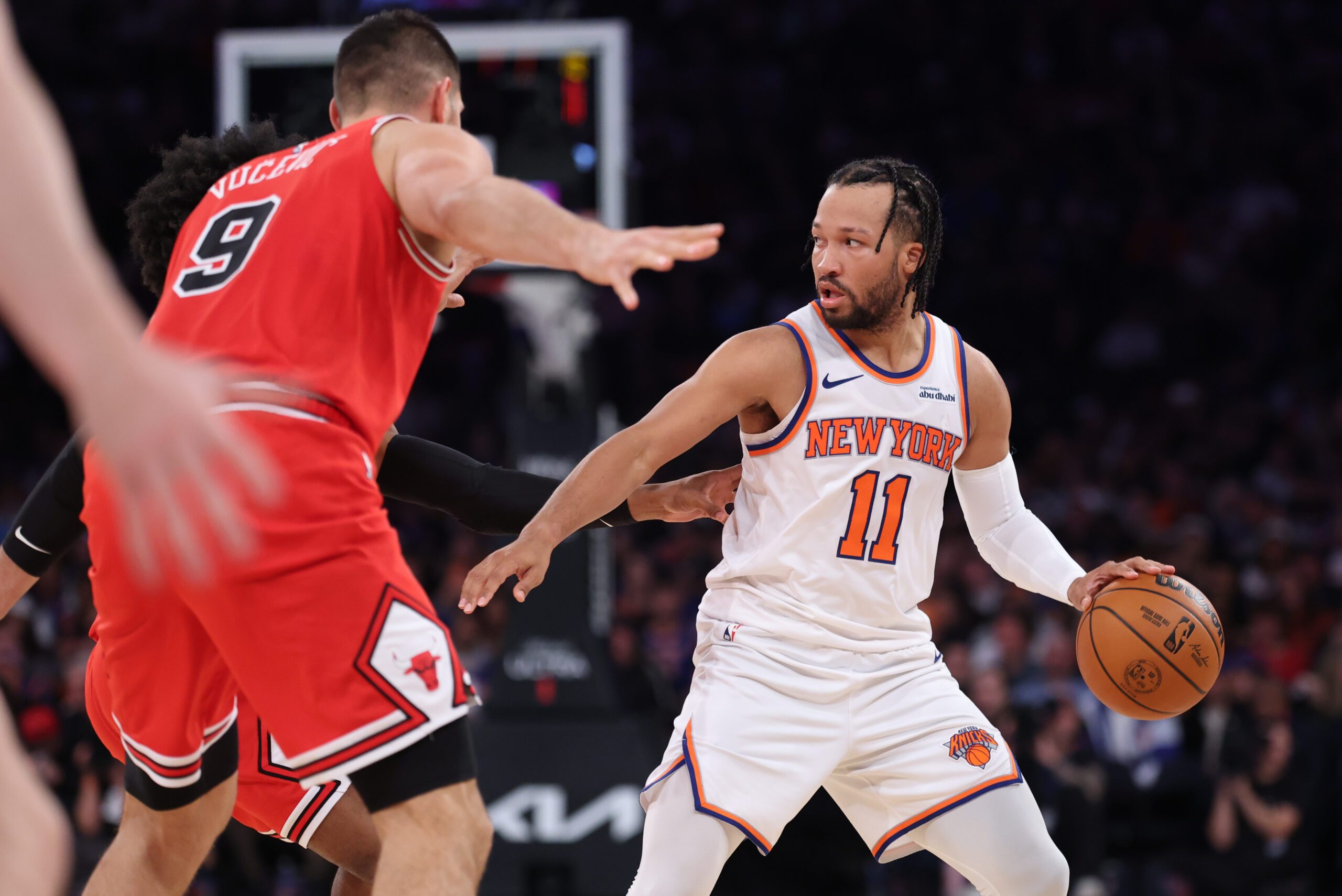 Nov 2, 2025; New York, New York, USA; New York Knicks guard Jalen Brunson (11) dribbles in front of Chicago Bulls center Nikola Vucevic (9) during the second half at Madison Square Garden. Mandatory Credit: Vincent Carchietta-Imagn Images