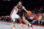 Nov 3, 2025; Columbus, Ohio, USA; IU Indy Jaguars forward Kameron Tinsley (20) drives to the basket as Ohio State Buckeyes forward Amare Bynum (1) defends during the first half at Value City Arena. Mandatory Credit: Joseph Maiorana-Imagn Images