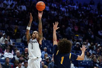 Nov 3, 2025; Storrs, Connecticut, USA; UConn Huskies guard Solo Ball (1) shoots against New Haven Chargers guard Jabri Fitzpatrick (1) in the second half at Harry A. Gampel Pavilion. Mandatory Credit: David Butler II-Imagn Images