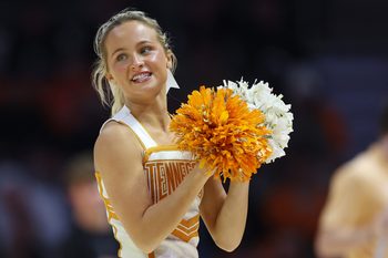Nov 3, 2025; Knoxville, Tennessee, USA;  A Tennessee Volunteers cheerleader performs during the second half against the Mercer Bears at Thompson-Boling Arena at Food City Center. Mandatory Credit: Randy Sartin-Imagn Images