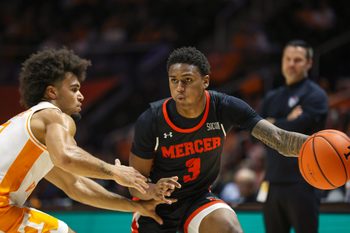 Nov 3, 2025; Knoxville, Tennessee, USA;  Mercer Bears guard Quinton Perkins II (3) passes the ball against the Tennessee Volunteers during the second half at Thompson-Boling Arena at Food City Center. Mandatory Credit: Randy Sartin-Imagn Images