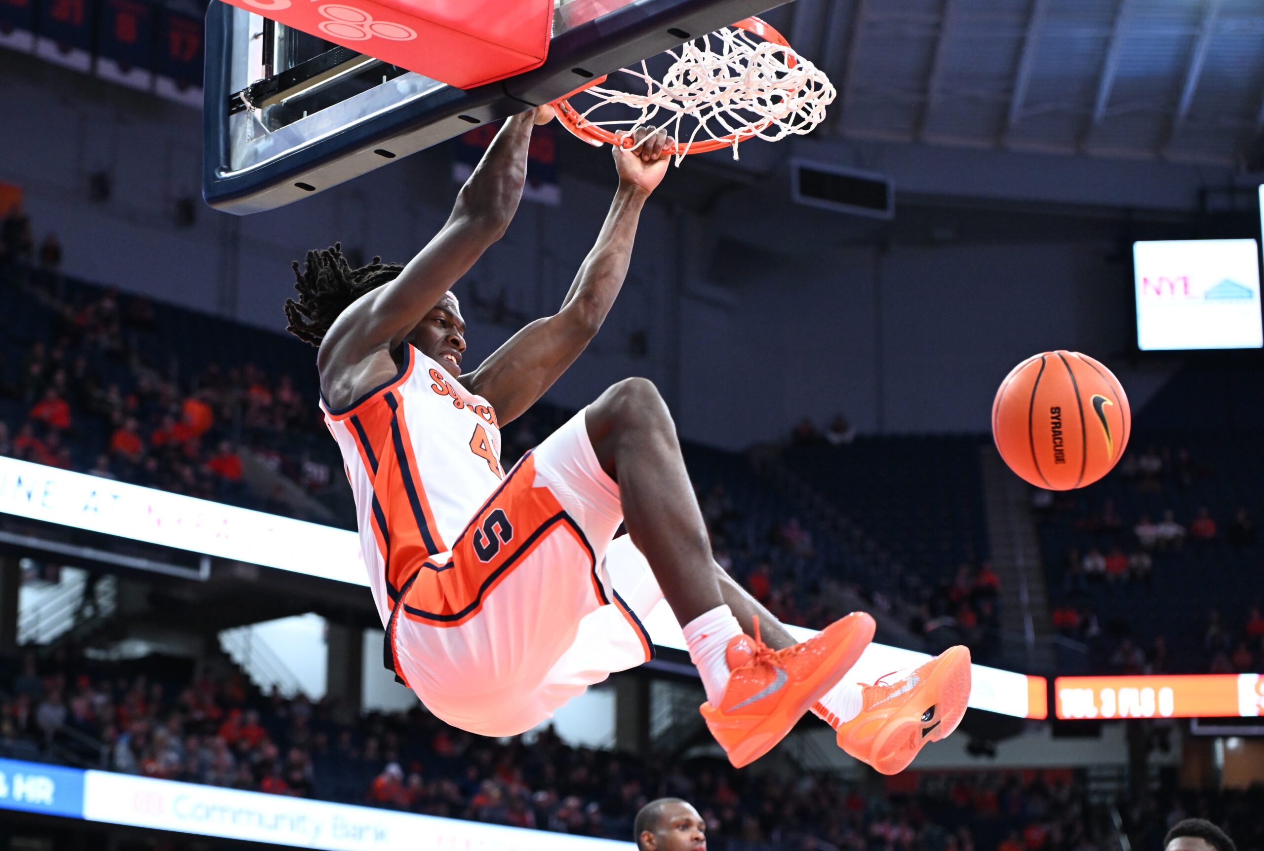 Nov 3, 2025; Syracuse, New York, USA; Syracuse Orange forward William Kyle III (42) dunks the ball in the second half against the Binghamton Bearcats at the JMA Wireless Dome. Mandatory Credit: Mark Konezny-Imagn Images