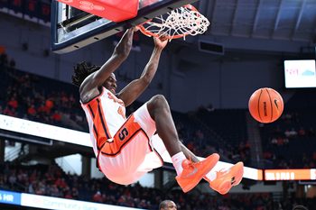 Nov 3, 2025; Syracuse, New York, USA; Syracuse Orange forward William Kyle III (42) dunks the ball in the second half against the Binghamton Bearcats at the JMA Wireless Dome. Mandatory Credit: Mark Konezny-Imagn Images