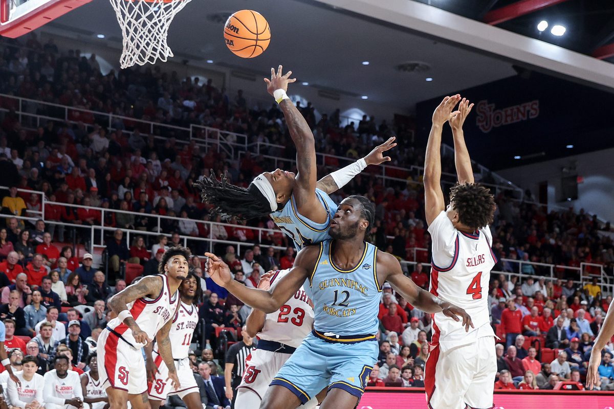Nov 3, 2025; Queens, New York, USA;  Quinnipiac Bobcats guard Jaden Zimmerman (24) collides with forward Spence Wewe (12) in the first half against the St. John's Red Storm at Carnesecca Arena. Mandatory Credit: Wendell Cruz-Imagn Images