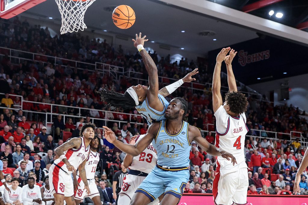Nov 3, 2025; Queens, New York, USA; Quinnipiac Bobcats guard Jaden Zimmerman (24) collides with forward Spence Wewe (12) in the first half against the St. John's Red Storm at Carnesecca Arena. Mandatory Credit: Wendell Cruz-Imagn Images