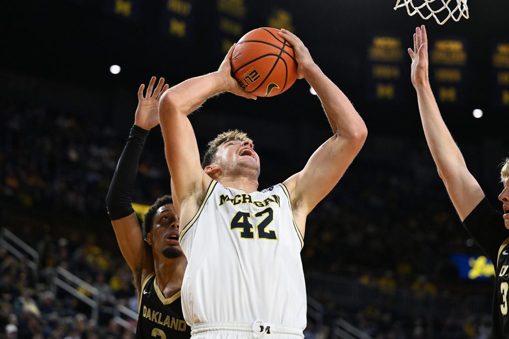 Nov 3, 2025; Ann Arbor, Michigan, USA; Michigan Wolverines forward Will Tschetter (42) drives against the Oakland Golden Grizzlies in the first half at Crisler Center. Mandatory Credit: Lon Horwedel-Imagn Images
