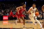 Xavier Musketeers forward Tre Carroll (12) drives on Marist Red Foxes forward Jaden Daughtry (11) in the second half of the basketball game at the Cintas Center on Nov. 3, 2025.
